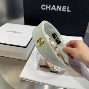 CHANEL White Headband with Gold Emblem